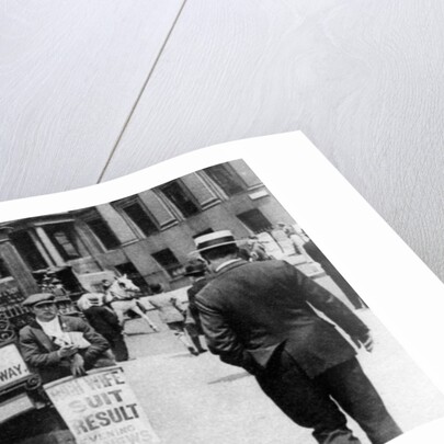 The lunchtime newspaper paper headlines, Trafalgar Square, London by Anonymous