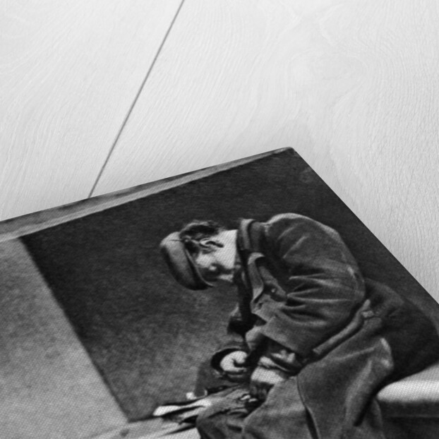 A man sleeping on Blackfriars Bridge, London by Walter Benington