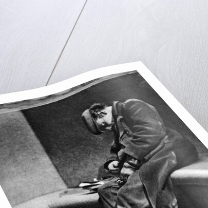 A man sleeping on Blackfriars Bridge, London by Walter Benington