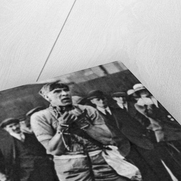 Escapologist entertaining theatre-goers in the 'pit' queue, London by Anonymous