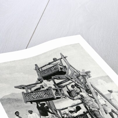 Arabian children enjoying a 'big-wheel' by Anonymous