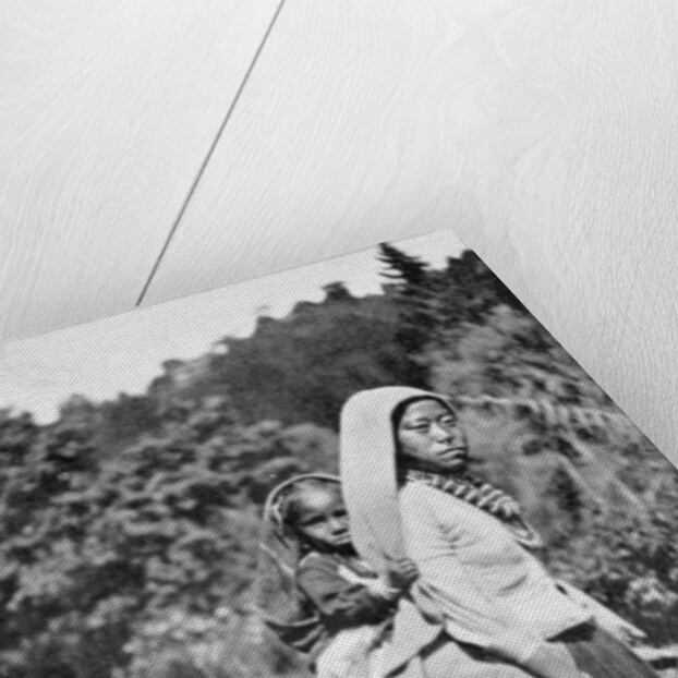 A Nepalese woman with her child by Anonymous