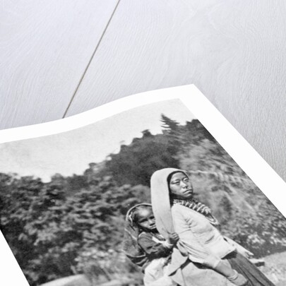 A Nepalese woman with her child by Anonymous