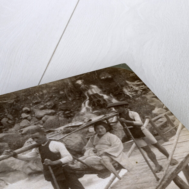 Japanese woman in a yamakago (mountain chair) crossing the torrential Daiya river near Nikko, Japan by Underwood & Underwood