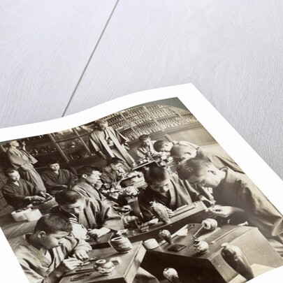 Expert workmen creating designs in cloisonne, Kyoto, Japan by Underwood & Underwood