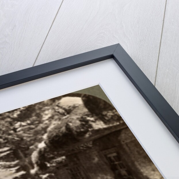 A woman Shinto devotee counting the stone lanterns, Kasuga Shrine, Nara, Japan by Underwood & Underwood