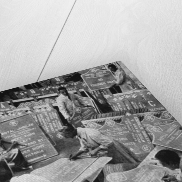 Men in the RAC Highways Department preparing traffic signs by Anonymous