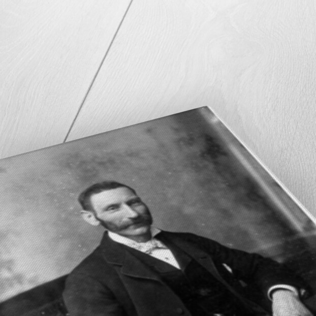 Man sitting in a chair by Theodore Waltenberg