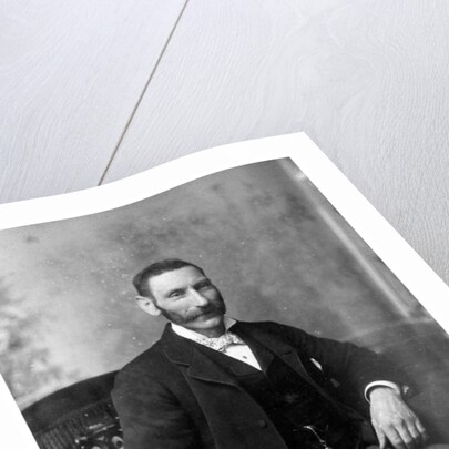 Man sitting in a chair by Theodore Waltenberg