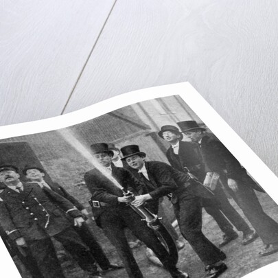 Eton's amateur firemen practising a hose drill, Berkshire by Anonymous
