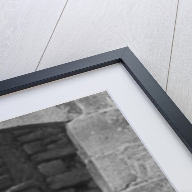 A woman at a spinning wheel, Dinan, Brittany, France by Anonymous