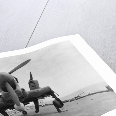 Fairey Firefly aircraft ready to be transported to the hangar lift, HMS Venerable by Anonymous