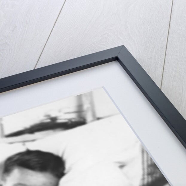 Greek boy from Pylos being nursed in the sick bay of the British battleship HMS Malaya by Anonymous