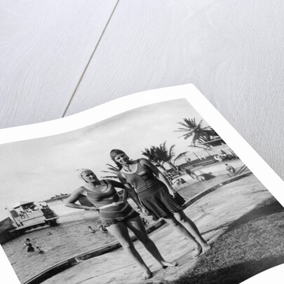 Two women in swimsuits beside a swimming pool, Balboa, Panama by Anonymous