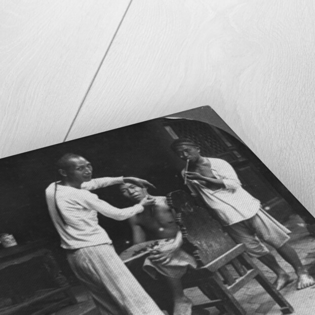 A Chinese barber at Bhamo, Burma by Stereo Travel Co