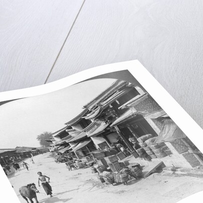 Main business street of the Chinese quarter, Bhamo, Burma by Stereo Travel Co