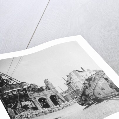 British tank in front of ruined buildings, Peronne, France, World War I by Nightingale & Co