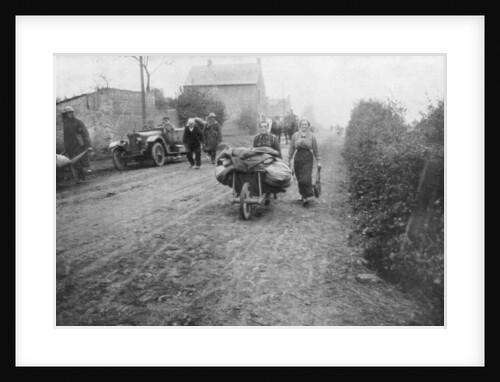 A British soldier helping a woman return to her village, France by Anonymous