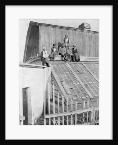 Tsar Nicholas II and his children sitting on a greenhouse, Tobolsk, Siberia, Russia by Anonymous