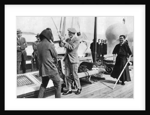 The Prince of Wales testing a Japanese fencing helmet, Japan by Anonymous