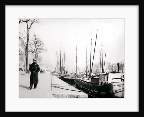 Policeman by a canal, Rotterdam by James Batkin