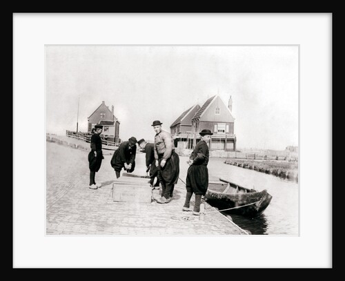 Men and boys in traditional costume by a canal bank, Marken Island, Netherlands by James Batkin