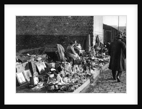 A display of goods at the flea market, Paris by Ernest Flammarion