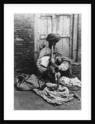 Snake charmer, India by Anonymous