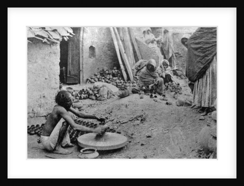 A potter at work, India by Anonymous