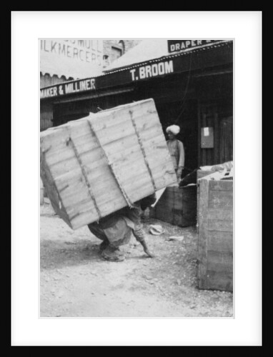A porter lifting a large load, Chakrata, India by Anonymous