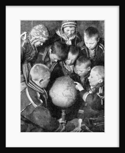 Lapp children looking at a globe by Anonymous
