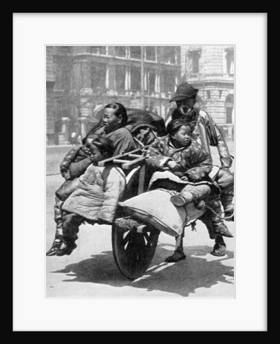 Chinese family on a cart by Sport & General