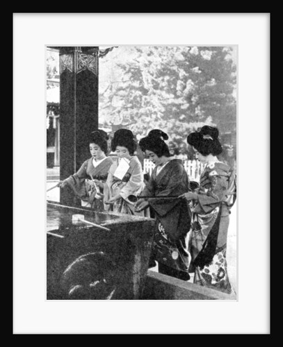 Japanese women washing their hands prior to entering a temple by Sport & General