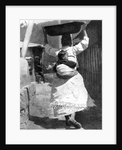 A Korean woman carrying a baby on her back by Wide World Photos