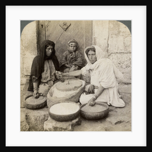 Women grinding at the mill, Palestine by Underwood & Underwood