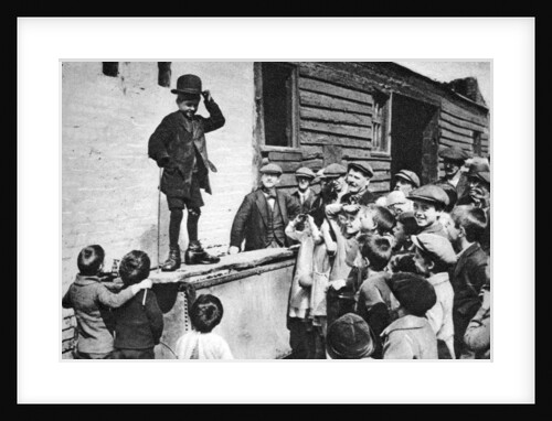 A budding Charlie Chaplin admirer, east end of London by Anonymous