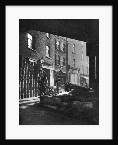 Fruit baskets piled against houses at Borough Market, London by Whiffin