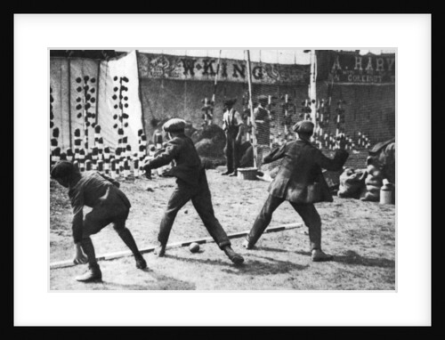 A coconut shy during a bank holiday on Blackheath Common, London by Hall