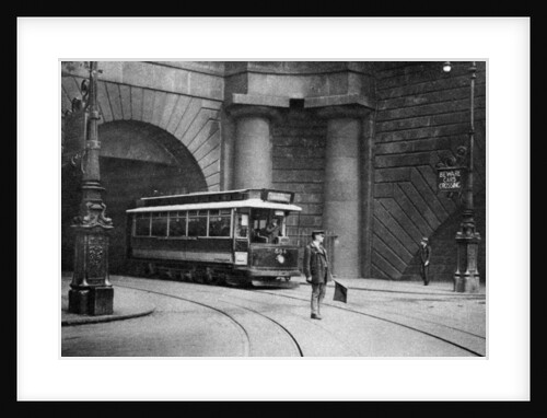 A tram running beneath Kingsway, Aldwych and Somerset House, London by Anonymous