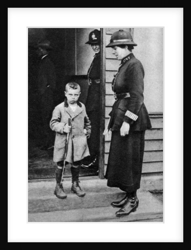 An East End child and a policewoman, London by Anonymous