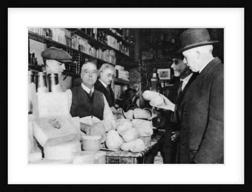 A customer inspects a haggis, London by Anonymous