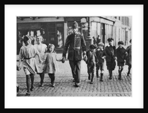 Policeman helping schoolchildren across the road, East End, London by Anonymous