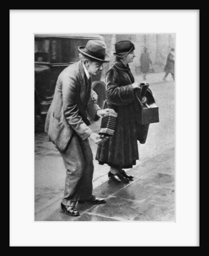 Kerb-side concertina-player, Holborn, London by Anonymous