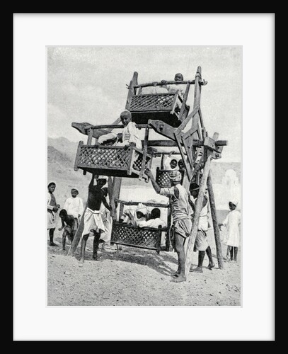 Arabian children enjoying a 'big-wheel' by Anonymous