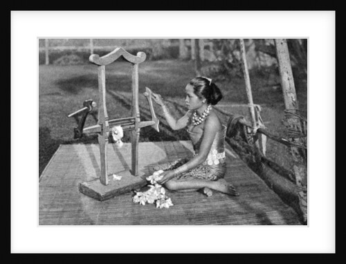 Iban woman making thread with a mangle, Borneo by Dr Charles Hose