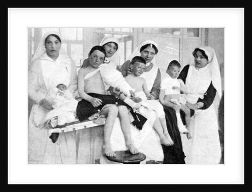 Wounded children from Ypres with nurses at La Panne, Belgium, First World War by Anonymous