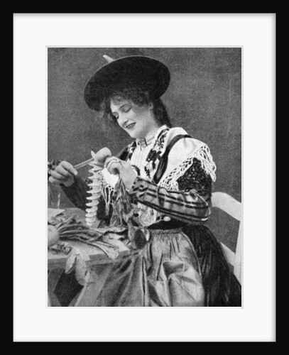 A woman creatively peeling a potato by Georg Haeckel