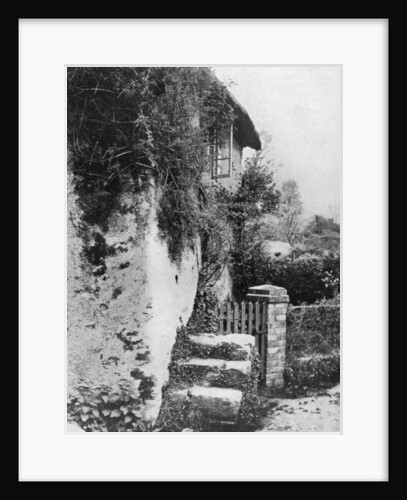 A cottage with an ancient 'upping stock', Cockington, Devon by HJ Smith