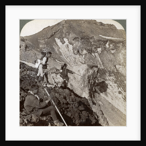 Peering from the lava encrusted rim down into Mount Fuji's (Fujiyama's) crater, Japan by Underwood & Underwood