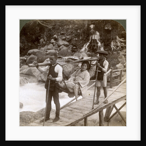 Japanese woman in a yamakago (mountain chair) crossing the torrential Daiya river near Nikko, Japan by Underwood & Underwood